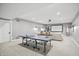 Finished basement features a ping pong table, media area with movie screen, and recessed lights at 6882 Bladstone Rd, Noblesville, IN 46062