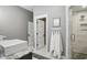 Stylish bathroom boasts dual sinks, walk-in shower, and modern fixtures at 6882 Bladstone Rd, Noblesville, IN 46062