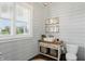 Charming powder room with wainscoting, vintage vanity and natural light at 6882 Bladstone Rd, Noblesville, IN 46062