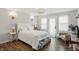 Bright bedroom featuring hardwood floors, natural light, light colored walls, and tasteful decor at 6882 Bladstone Rd, Noblesville, IN 46062
