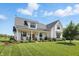 Charming two-story home with a covered front porch, perfect for relaxing and enjoying the outdoors at 6882 Bladstone Rd, Noblesville, IN 46062