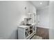 Hallway features a white storage cabinet with glass doors and decorative accents at 6882 Bladstone Rd, Noblesville, IN 46062