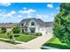 Stunning home exterior with a well-manicured lawn and driveway at 6882 Bladstone Rd, Noblesville, IN 46062