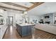 Open concept kitchen with large island, stone fireplace and hardwood floors at 6882 Bladstone Rd, Noblesville, IN 46062