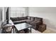 Cozy living room featuring a comfortable couch, coffee table, and natural light at 6882 Bladstone Rd, Noblesville, IN 46062