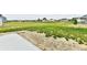Expansive backyard overlooking a neighborhood pond, offering a serene outdoor setting at 6883 Honeysuckle Way, Pendleton, IN 46064
