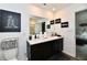 Bathroom featuring double vanity, toilet, and decorative artwork at 6883 Honeysuckle Way, Pendleton, IN 46064