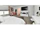 Open bedroom featuring a TV, plenty of seating, and a vanity at 6883 Honeysuckle Way, Pendleton, IN 46064