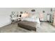 Spacious bedroom featuring white bedding, a vanity, and mirrored furnishings at 6883 Honeysuckle Way, Pendleton, IN 46064