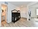 Welcoming entryway with modern decor, a stylish cabinet, and views of the bathroom at 6883 Honeysuckle Way, Pendleton, IN 46064