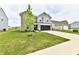 Well-kept two-story home featuring a combination of brick and vinyl siding, complemented by a lush green lawn at 6883 Honeysuckle Way, Pendleton, IN 46064