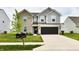 Attractive two-story home featuring a well-maintained lawn, two mailboxes and a spacious two-car garage at 6883 Honeysuckle Way, Pendleton, IN 46064