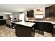 Contemporary kitchen with a island, stainless steel appliances, and views into the dining and living room at 6883 Honeysuckle Way, Pendleton, IN 46064