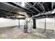 Spacious unfinished basement with visible ceiling pipes at 701 E Memorial Dr, Muncie, IN 47302