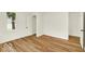 Bedroom with laminate floors, white walls, and closet at 701 E Memorial Dr, Muncie, IN 47302