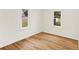 Bedroom with laminate floors, white walls, and windows for natural light at 701 E Memorial Dr, Muncie, IN 47302