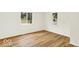 Cozy bedroom with updated floors, white walls, and natural light at 701 E Memorial Dr, Muncie, IN 47302