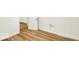 Bedroom featuring wood-look floors, white paint, and a closet at 701 E Memorial Dr, Muncie, IN 47302