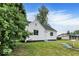 Quaint home showcases fresh white paint and well-kept lawn in quiet neighborhood at 701 E Memorial Dr, Muncie, IN 47302