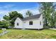 Charming single-story home featuring white siding, a well-maintained lawn, and a classic design at 701 E Memorial Dr, Muncie, IN 47302