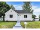 Charming home featuring a well-manicured lawn, and inviting entrance at 701 E Memorial Dr, Muncie, IN 47302