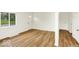 Bright living room featuring new flooring, fresh paint, and ample space at 701 E Memorial Dr, Muncie, IN 47302