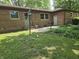 A well-kept backyard features a brick patio ideal for grilling and outdoor relaxation at 7088 Sandalwood Dr, Indianapolis, IN 46217
