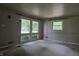 Bright living room featuring large windows that offer abundant natural light and views of the surrounding landscape at 7088 Sandalwood Dr, Indianapolis, IN 46217