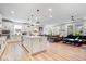 Open-concept living area with kitchen, dining space, and cozy seating, perfect for modern living at 7154 Covington St, Lebanon, IN 46052
