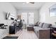 Functional home office with desk setup, a comfortable couch, and a large screen monitor at 7154 Covington St, Lebanon, IN 46052