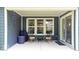 Covered outdoor patio with seating, offering a relaxing space with backyard views and modern home siding at 7154 Covington St, Lebanon, IN 46052