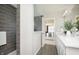 Contemporary bathroom showcasing a tiled shower and double vanity with modern design at 7177 Firestone Rd, Whitestown, IN 46052