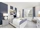 Stylish bedroom featuring a large window, patterned accent wall, and modern furnishings at 7177 Firestone Rd, Whitestown, IN 46052