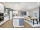 Modern kitchen and dining area featuring stainless appliances, hardwood flooring, and contemporary decor at 7177 Firestone Rd, Whitestown, IN 46052