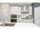 A modern kitchen featuring white cabinets, stainless steel appliances, and a subway tile backsplash at 7177 Firestone Rd, Whitestown, IN 46052