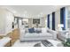 Open-concept living room featuring hardwood floors, modern furnishings, and plenty of natural light at 7177 Firestone Rd, Whitestown, IN 46052