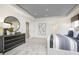 Main bedroom with a dresser, stylish mirror and contemporary decor at 7177 Firestone Rd, Whitestown, IN 46052