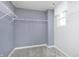 Spacious walk-in closet with white wire shelving and gray walls at 7177 Firestone Rd, Whitestown, IN 46052