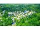 Expansive aerial view of a lush, green community with homes and trees at 7212 Maple Bluff Pl, Indianapolis, IN 46236