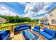 This is a beautiful backyard deck featuring modern outdoor furniture and a lovely scenic backdrop at 7212 Maple Bluff Pl, Indianapolis, IN 46236