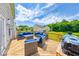 Backyard deck featuring modern patio furniture, a grill, and a lovely scenic view at 7212 Maple Bluff Pl, Indianapolis, IN 46236