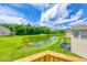 The backyard features a lovely scenic view, a pond, and a deck at 7212 Maple Bluff Pl, Indianapolis, IN 46236