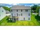 Expansive backyard featuring a spacious wooden deck and lush green lawn at 7212 Maple Bluff Pl, Indianapolis, IN 46236