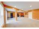 Spacious basement featuring carpet floors and multiple columns at 7212 Maple Bluff Pl, Indianapolis, IN 46236