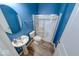 Bright bathroom features a shower with sliding glass doors and contemporary fixtures at 7212 Maple Bluff Pl, Indianapolis, IN 46236
