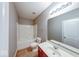 Bathroom featuring a tub with jets, ample lighting, and tile floors at 7212 Maple Bluff Pl, Indianapolis, IN 46236