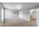 Bedroom featuring carpet floors, overhead lighting, and ample closet space at 7212 Maple Bluff Pl, Indianapolis, IN 46236