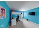 Bedroom with blue walls, built-in desk, shelves, and ample natural light at 7212 Maple Bluff Pl, Indianapolis, IN 46236