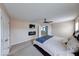 Spacious bedroom featuring a ceiling fan and a fireplace at 7212 Maple Bluff Pl, Indianapolis, IN 46236