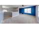 Bonus room features neutral carpet, large window and modern lighting at 7212 Maple Bluff Pl, Indianapolis, IN 46236